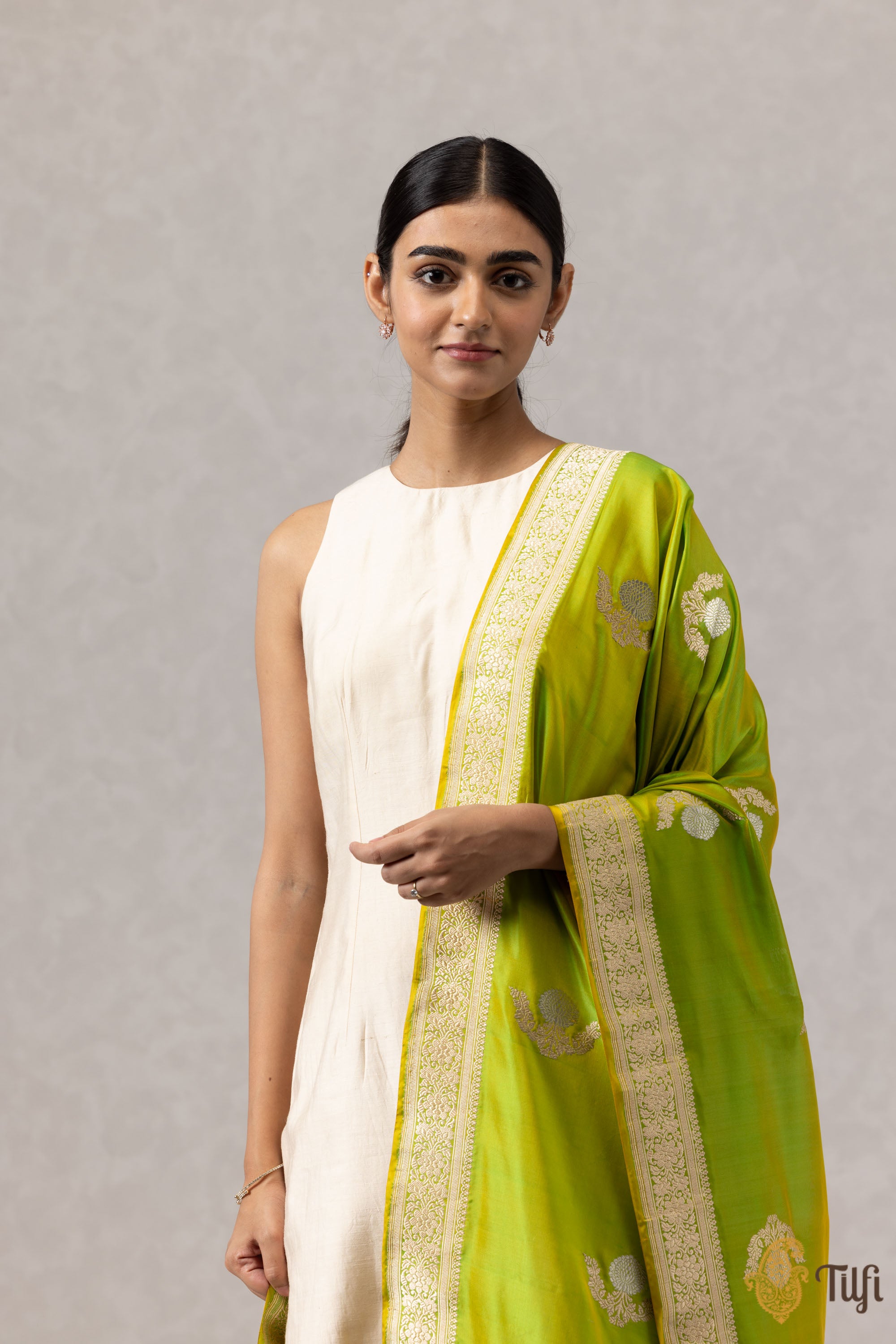 Close-up view of the yellow-green Katan silk Banarasi dupatta highlighting the intricate Kadwa motifs and soft texture.