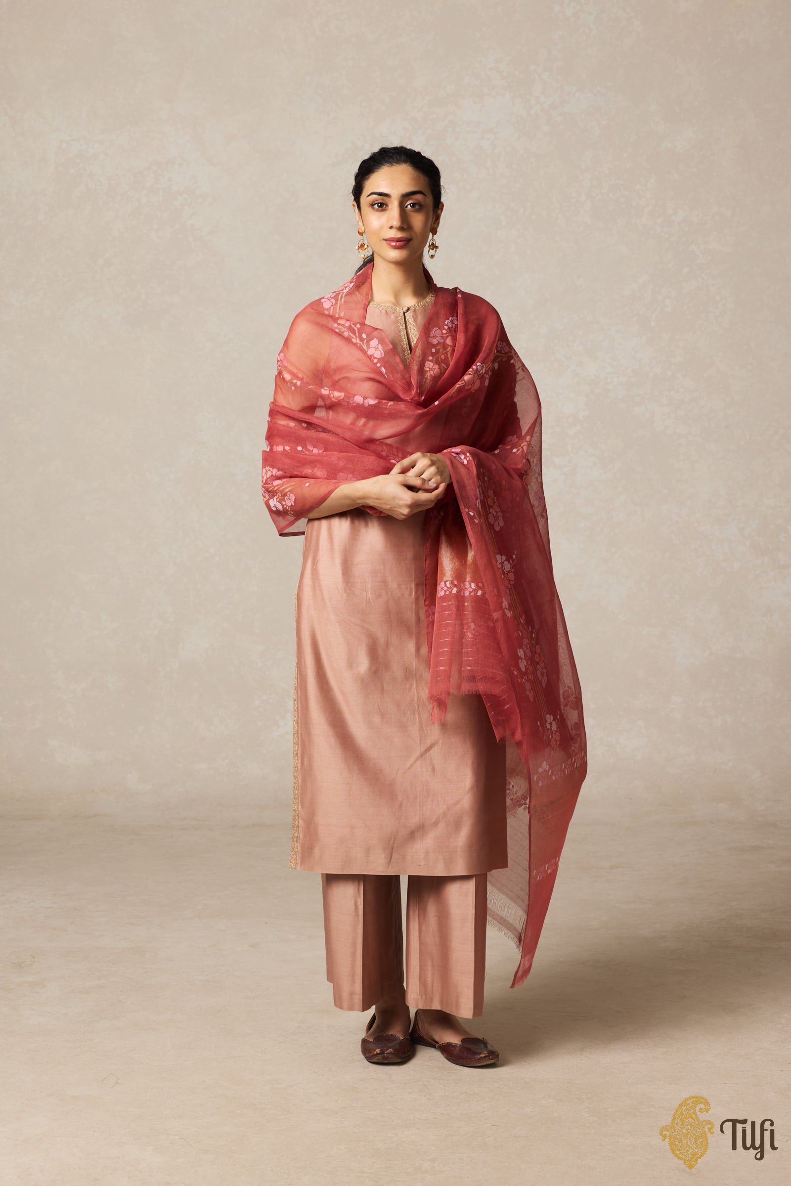 Aki terracotta red premium handcrafted jamdani dupatta draped elegantly over a model showcasing its beauty.