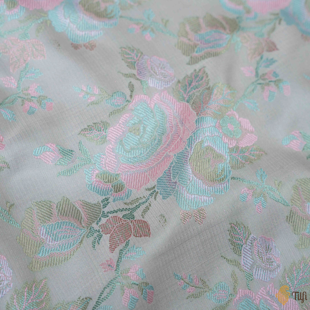 Detailed view of Powder Blue satin silk Banarasi fabric with floral design