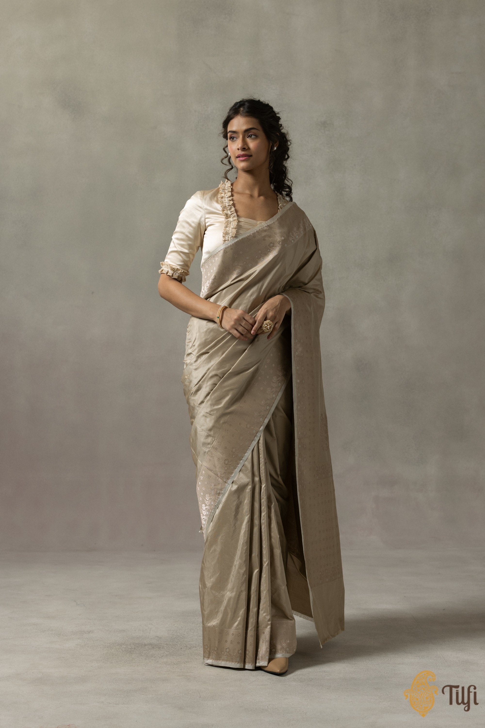 Front view of Isabelle Smokey Taupe silk saree showcasing floral Banarasi border