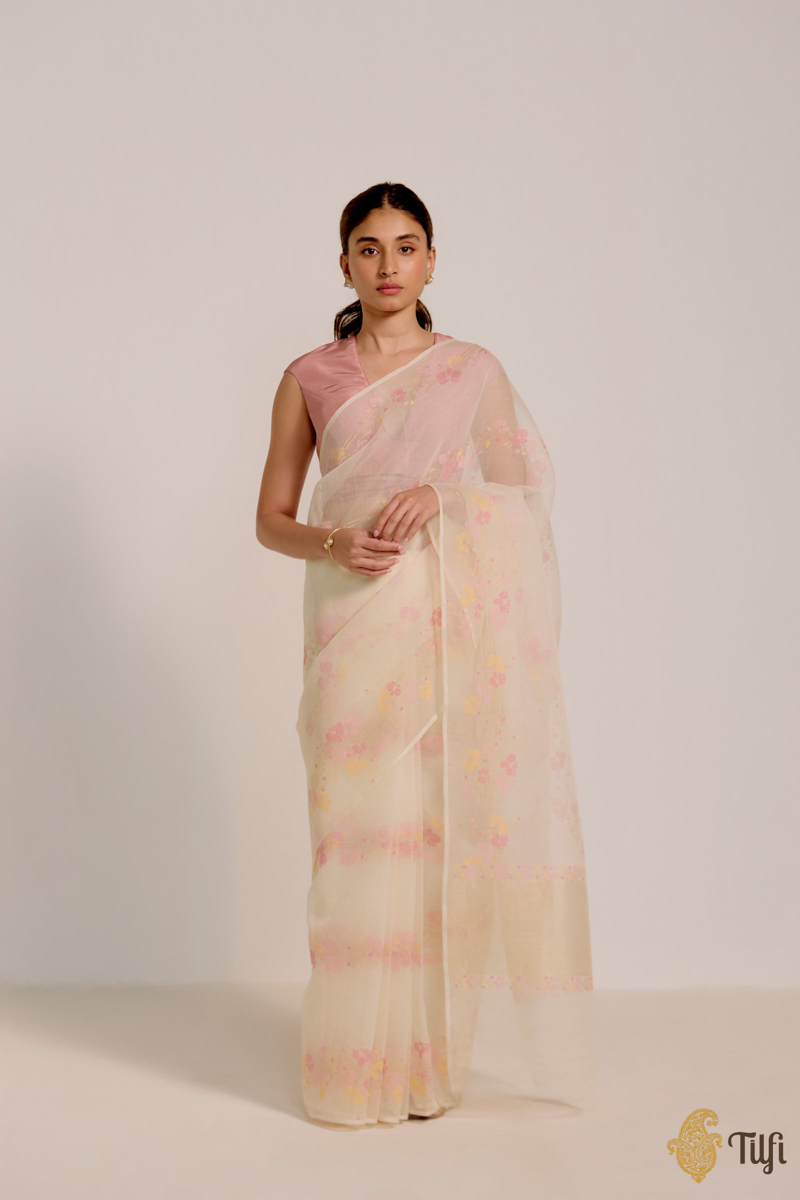 Aki Off-White Jamdani Saree draped elegantly, showcasing the intricate zari work.