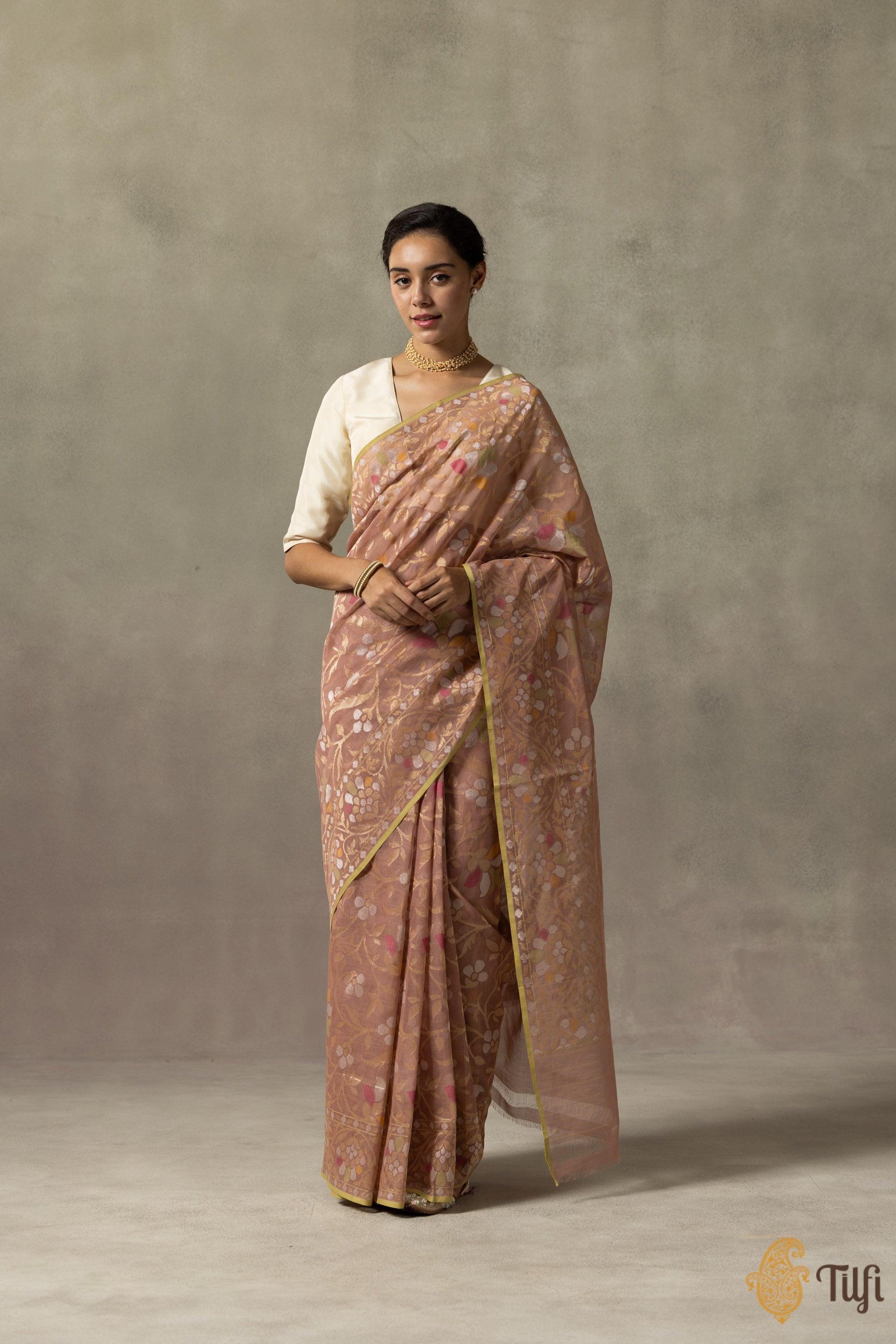 Mandakini saree showcasing intricate Jamdani patterns and real zari work from the side view.