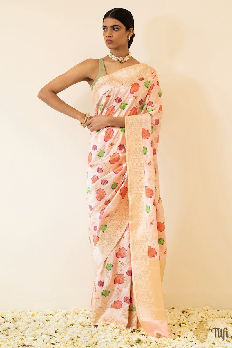 Close-up of intricate floral Meenakari jaal on ivory-pink Banarasi silk saree