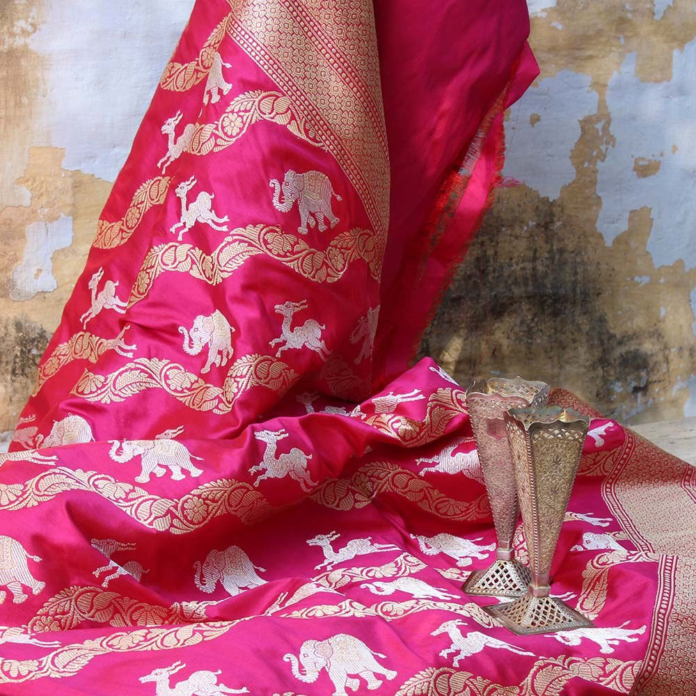 Close-up of gold zari detailing on Banarasi saree with elephant motifs